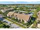 Aerial view of the condo complex showing well-maintained buildings, lush landscaping, and convenient parking areas at 4006 Crockers Lake Blvd # 212, Sarasota, FL 34238