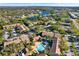 Beautiful aerial view highlighting the community, amenities, pool, and well-manicured landscaping surrounded by lush greenery at 4006 Crockers Lake Blvd # 212, Sarasota, FL 34238