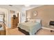 Comfortable bedroom featuring a ceiling fan, neutral color scheme, and a bookcase enhancing its serene atmosphere at 4006 Crockers Lake Blvd # 212, Sarasota, FL 34238