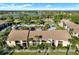 A detailed view of the building's facade, with well-kept landscaping and convenient parking, creating a welcoming atmosphere at 4006 Crockers Lake Blvd # 212, Sarasota, FL 34238
