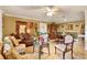 Inviting living room with comfortable seating and an adjacent dining area at 4006 Crockers Lake Blvd # 212, Sarasota, FL 34238