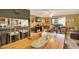 Open living space featuring bar seating, a dining area, and comfortable living area at 4006 Crockers Lake Blvd # 212, Sarasota, FL 34238