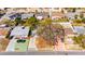 Aerial view showcasing the property's boundaries, driveway, mature landscaping, and proximity to neighboring homes at 4111 Moog Rd, Holiday, FL 34691