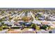 Overhead shot displaying property location, showcasing its position among houses, streets, and vegetation at 4111 Moog Rd, Holiday, FL 34691