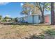 Home's backyard with a fenced in area, patio furniture, and mature trees at 4111 Moog Rd, Holiday, FL 34691