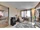 Living room with cozy seating and a small table near a sliding glass door at 4111 Moog Rd, Holiday, FL 34691