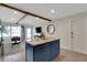 Kitchen featuring a large island, custom cabinets, stone countertops, and an open layout at 423 62Nd St, Holmes Beach, FL 34217