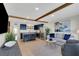 Inviting living room open to the kitchen with tile floors, recessed lights, and wood beam at 423 62Nd St, Holmes Beach, FL 34217