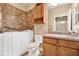 Bathroom featuring a walk-in tub, tiled floors, tiled shower and wood cabinets at 4813 Michelle Ln, Palm Harbor, FL 34684