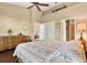 Spacious bedroom features a ceiling fan, neutral paint, and ensuite bathroom at 4813 Michelle Ln, Palm Harbor, FL 34684
