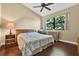 Bedroom with hardwood floors and large window that provides plenty of natural light at 4813 Michelle Ln, Palm Harbor, FL 34684