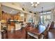 Open-concept living and dining area with wood floors, vaulted ceilings and lots of natural light at 4813 Michelle Ln, Palm Harbor, FL 34684