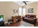 Home office with hardwood floors, area rug and lots of natural light at 4813 Michelle Ln, Palm Harbor, FL 34684