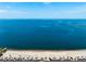 Breathtaking aerial view of a sandy beach with clear blue waters stretching to the horizon, perfect for relaxation at 5241 West Shore Dr, New Port Richey, FL 34652