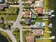 An aerial view shows the waterfront community with boat docks and private pools at 5241 West Shore Dr, New Port Richey, FL 34652