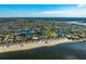 Picturesque aerial view of a waterfront community with canal access, beach, and meticulously landscaped properties at 5241 West Shore Dr, New Port Richey, FL 34652