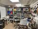 A basement area with plenty of space for tools and storage, featuring large shelves at 5241 West Shore Dr, New Port Richey, FL 34652