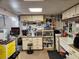 A well-organized basement area, featuring cabinets, pegboards, and ample storage for tools and projects at 5241 West Shore Dr, New Port Richey, FL 34652