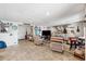 Basement space offering tiled flooring, comfortable seating and secondary access to the home at 5241 West Shore Dr, New Port Richey, FL 34652