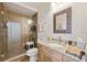 Beautiful bathroom with walk-in shower, granite countertop, and mosaic mirror at 5241 West Shore Dr, New Port Richey, FL 34652