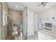 Bright bathroom featuring a glass shower, granite counters, and updated fixtures at 5241 West Shore Dr, New Port Richey, FL 34652