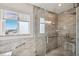 Walk-in shower with tile surround and glass door providing spa-like experience at 5241 West Shore Dr, New Port Richey, FL 34652