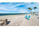 Relax on the sandy beach with comfortable chairs and a picturesque ocean backdrop at 5241 West Shore Dr, New Port Richey, FL 34652