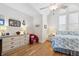 Bright bedroom featuring stylish decor, hardwood floors, and natural lighting at 5241 West Shore Dr, New Port Richey, FL 34652