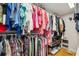 Walk-in closet with custom shelving and ample storage space for an organized wardrobe at 5241 West Shore Dr, New Port Richey, FL 34652