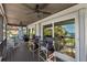 Spacious covered deck with comfortable seating, perfect for relaxing and enjoying the view at 5241 West Shore Dr, New Port Richey, FL 34652