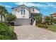 Charming two-story home with landscaped yard and a paved driveway at 5241 West Shore Dr, New Port Richey, FL 34652