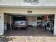 Open garage with a black SUV parked inside, offering ample space for vehicles and storage at 5241 West Shore Dr, New Port Richey, FL 34652