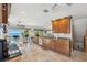 A gourmet kitchen boasts granite countertops, stainless steel appliances, and scenic views of the ocean at 5241 West Shore Dr, New Port Richey, FL 34652