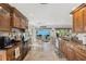 Well-appointed kitchen with granite countertops, wooden cabinetry, and a dining area with water views at 5241 West Shore Dr, New Port Richey, FL 34652