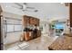Bright kitchen with granite counters, stainless steel appliances, and a wine bar, perfect for entertaining guests at 5241 West Shore Dr, New Port Richey, FL 34652