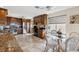 Warm kitchen featuring granite countertops, stainless steel appliances, and a cozy breakfast nook at 5241 West Shore Dr, New Port Richey, FL 34652