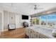 Serene main bedroom with hardwood floors, balcony access, and water views at 5241 West Shore Dr, New Port Richey, FL 34652