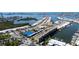 Aerial view of condo community, featuring boat docks, tennis courts, and waterfront access at 580 Boca Ciega Point S Blvd, St Petersburg, FL 33708