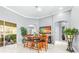 Inviting dining area features neutral walls, tiled floors, modern decor, and a view of the lanai at 6209 Cypress Bend Ct, Bradenton, FL 34201