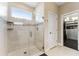 Bathroom with glass shower and a view into the walk-in closet at 7096 Heron Walk Ln, Wesley Chapel, FL 33545