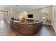 Comfortable living room features a large sectional sofa and a modern entertainment center at 7096 Heron Walk Ln, Wesley Chapel, FL 33545
