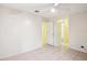 Neutral-toned bedroom featuring tile flooring, ceiling fan, and direct access to a nearby bathroom for added convenience at 8001 Jasmine Dr # 8001, Temple Terrace, FL 33637