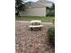Exterior view of the property with a stone picnic table and grass at 8001 Jasmine Dr # 8001, Temple Terrace, FL 33637
