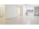 Bright living room with tile flooring open to the kitchen, perfect for entertaining and comfortable living at 8001 Jasmine Dr # 8001, Temple Terrace, FL 33637
