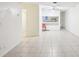 Open living room featuring neutral walls and tile flooring, providing a versatile space for relaxation and decor at 8001 Jasmine Dr # 8001, Temple Terrace, FL 33637