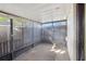 Enclosed patio with screens and a concrete floor, offering outdoor living space at 8001 Jasmine Dr # 8001, Temple Terrace, FL 33637