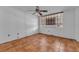 Bright bedroom featuring tile floors, window with wood blinds, and ceiling fan at 1001 Pearce Dr # 106, Clearwater, FL 33764