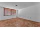Bright bedroom featuring tile floors and a window with wood blinds at 1001 Pearce Dr # 106, Clearwater, FL 33764