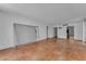 Large living room area featuring tile floors and a pass-through to the kitchen at 1001 Pearce Dr # 106, Clearwater, FL 33764