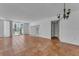 Open living area with terracotta tile flooring and sliding glass doors to the patio at 1001 Pearce Dr # 106, Clearwater, FL 33764